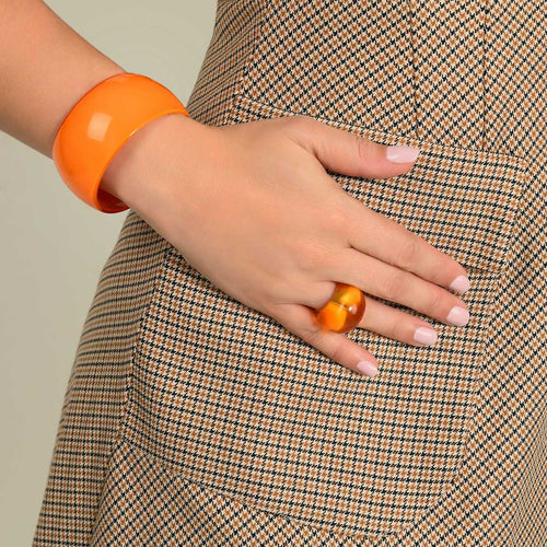 Kara cuff in orange acetate